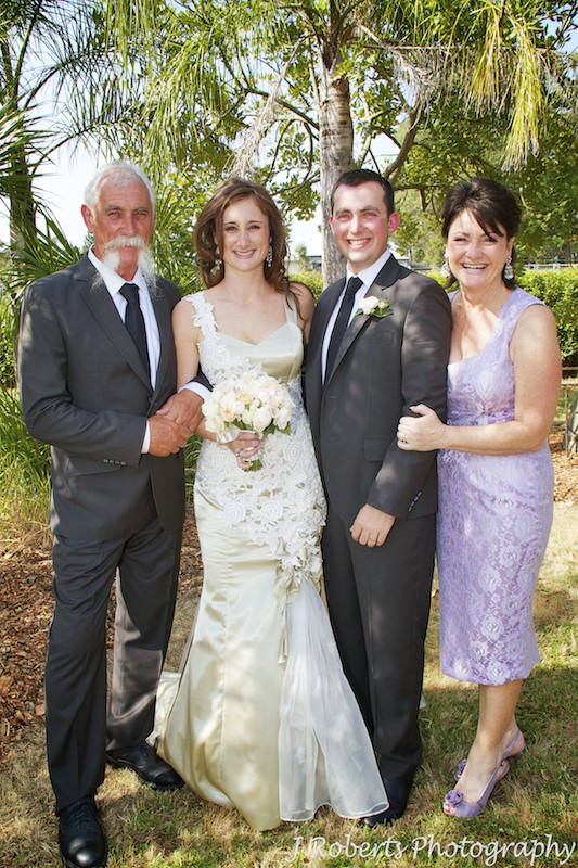 Couple laughing with brides parents - wedding photography sydney
